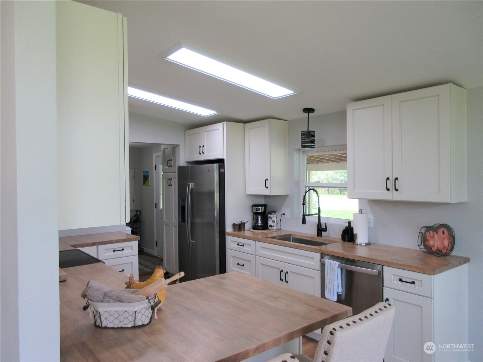 156 West Curlew Lake Road Republic, WA 99166 - Photo 4 of 36 a kitchen with a refrigerator and a sink