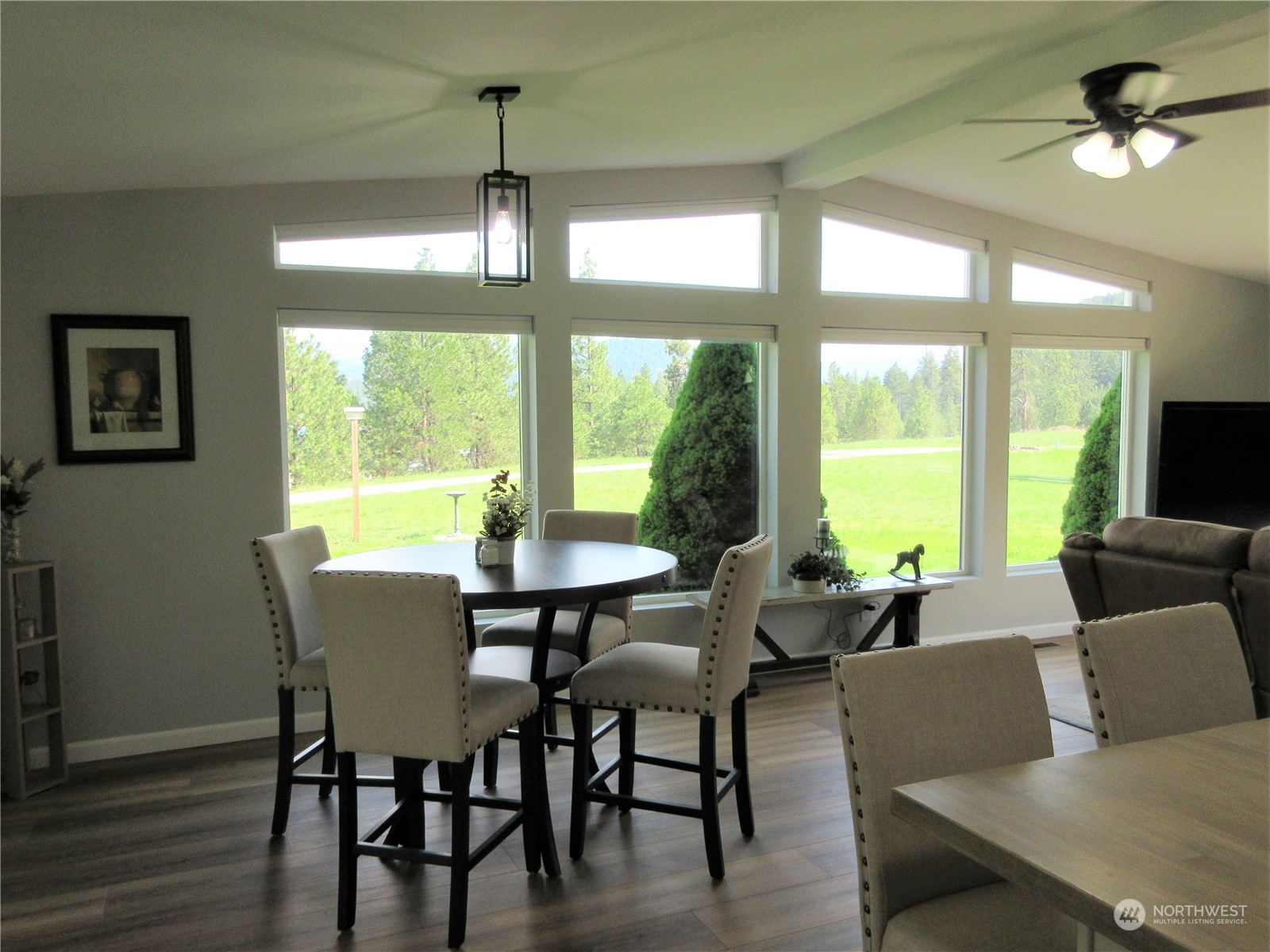156 West Curlew Lake Road Republic, WA 99166 - Photo 5 of 36 a dining room with furniture a chandelier and wooden floor