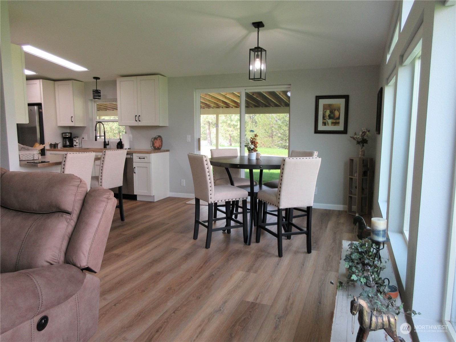 156 West Curlew Lake Road Republic, WA 99166 - Photo 9 of 36 a view of a dining room with furniture and wooden floor