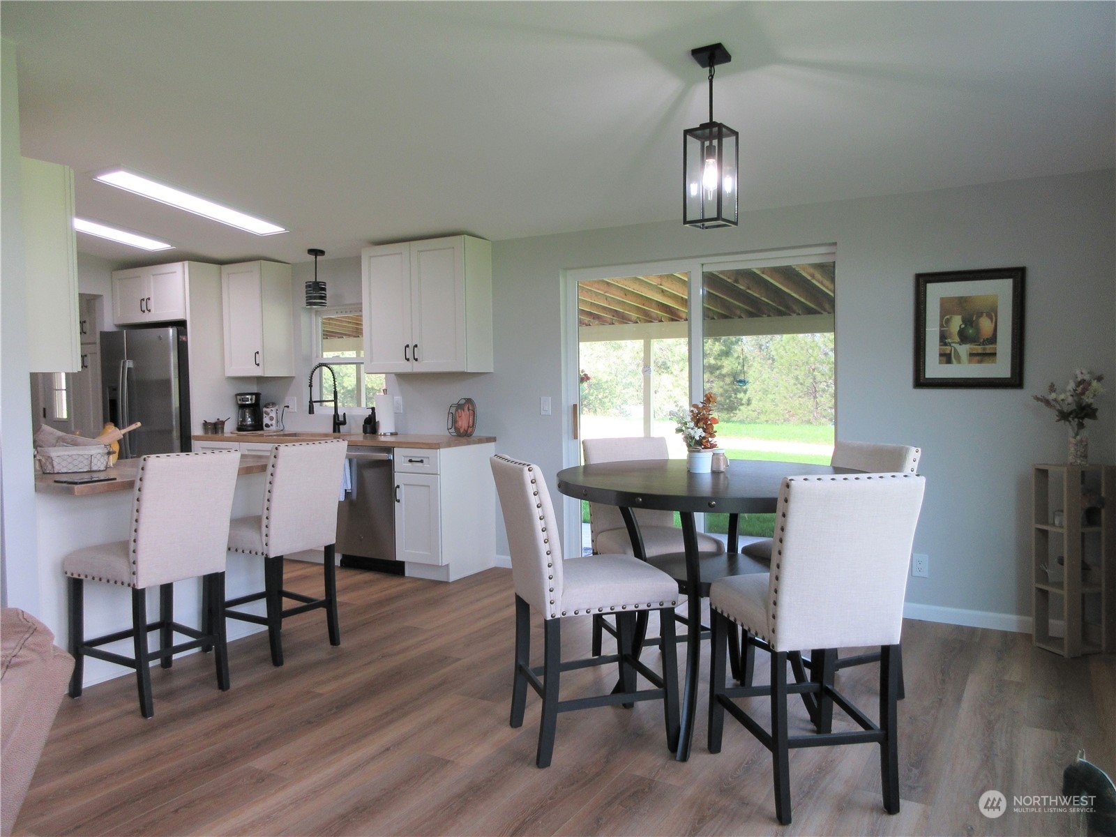 156 West Curlew Lake Road Republic, WA 99166 - Photo 10 of 36 a dining room with furniture window and wooden floor