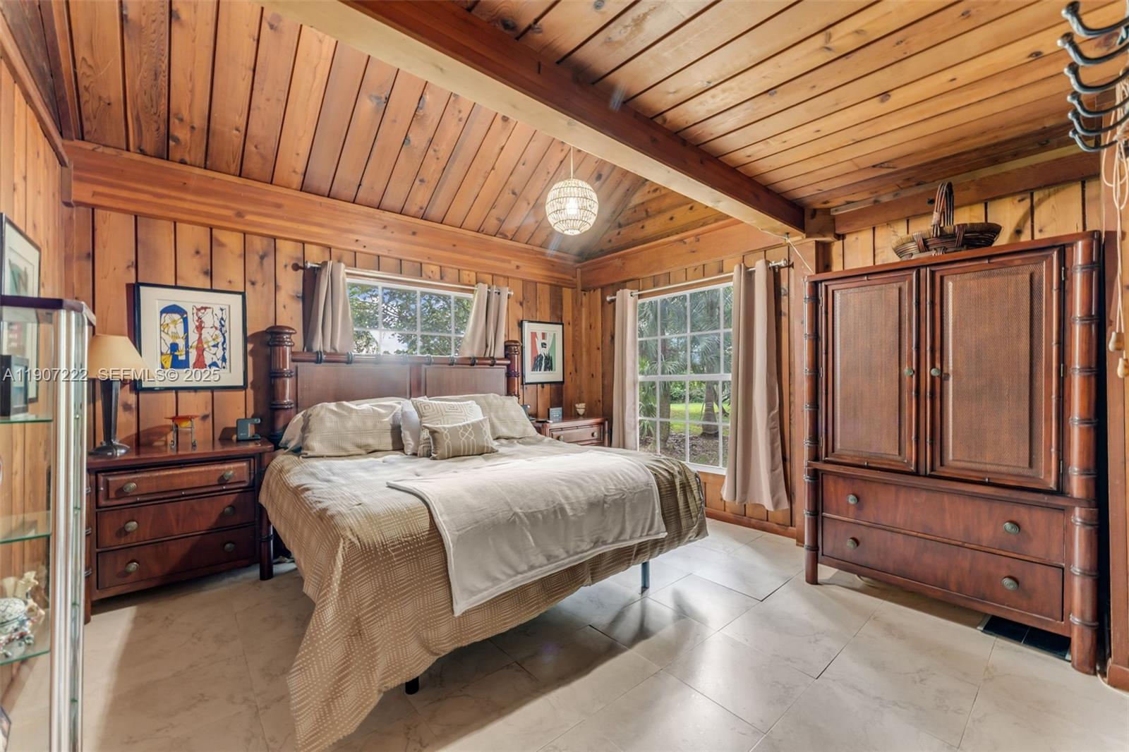 18895 Southwest 212th Street Miami, FL 33187 - Photo 16 of 36 a spacious bedroom with a bed and a dresser