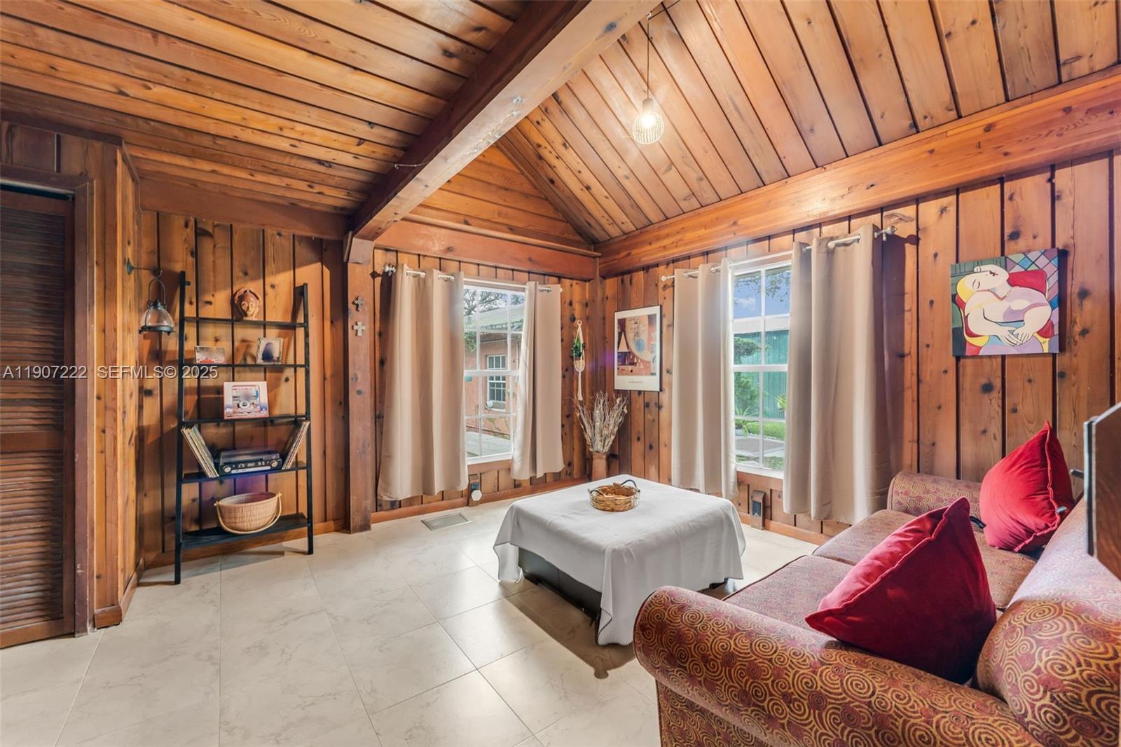 18895 Southwest 212th Street Miami, FL 33187 - Photo 19 of 36 a bedroom with furniture and large windows