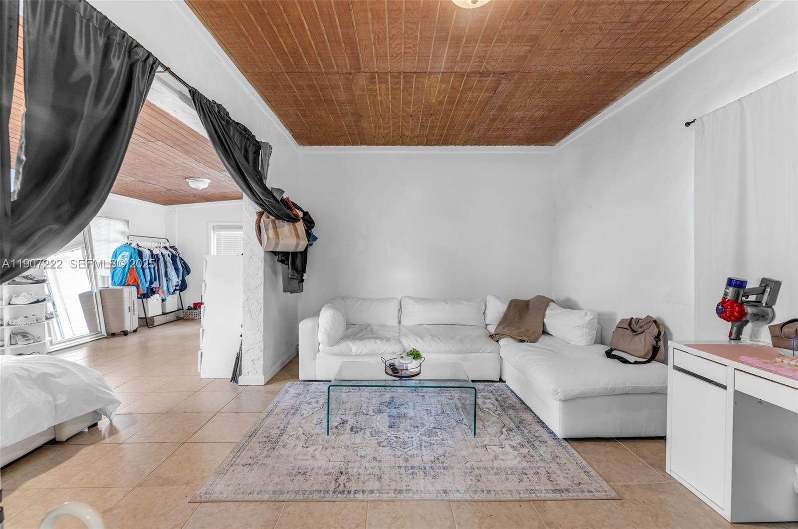 18895 Southwest 212th Street Miami, FL 33187 - Photo 23 of 36 a living room with furniture and a couch