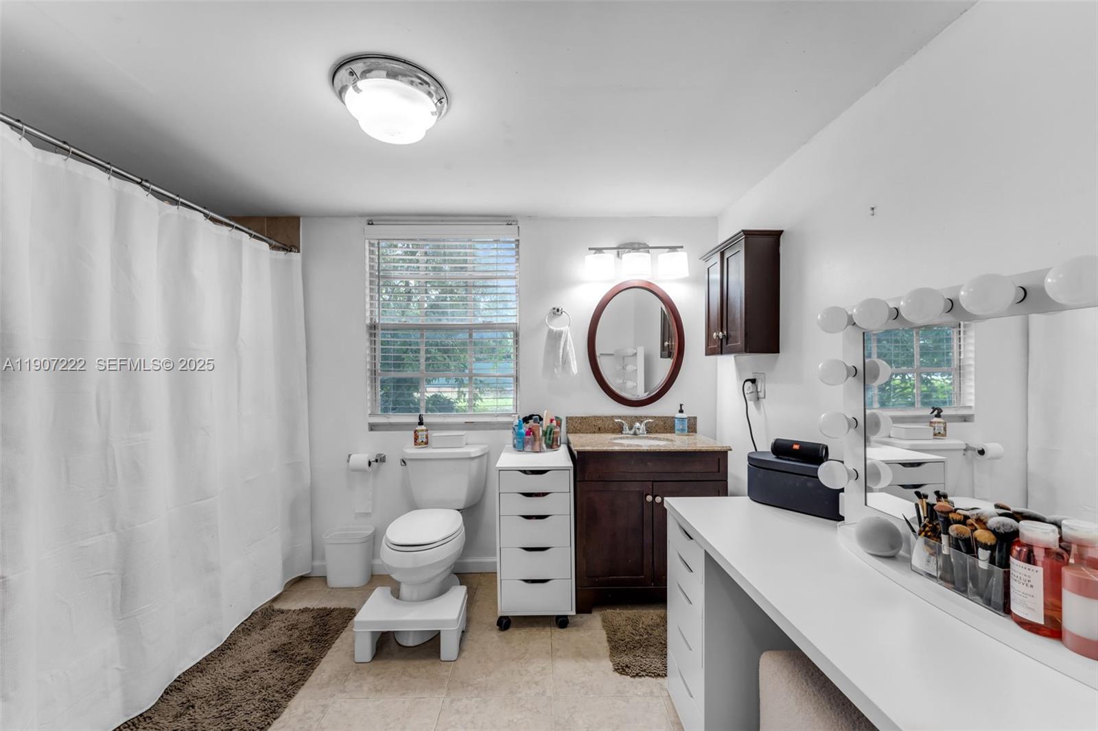 18895 Southwest 212th Street Miami, FL 33187 - Photo 25 of 36 a very nice looking room with a large window and cabinets