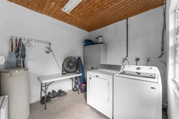 a utility room with dryer and washer