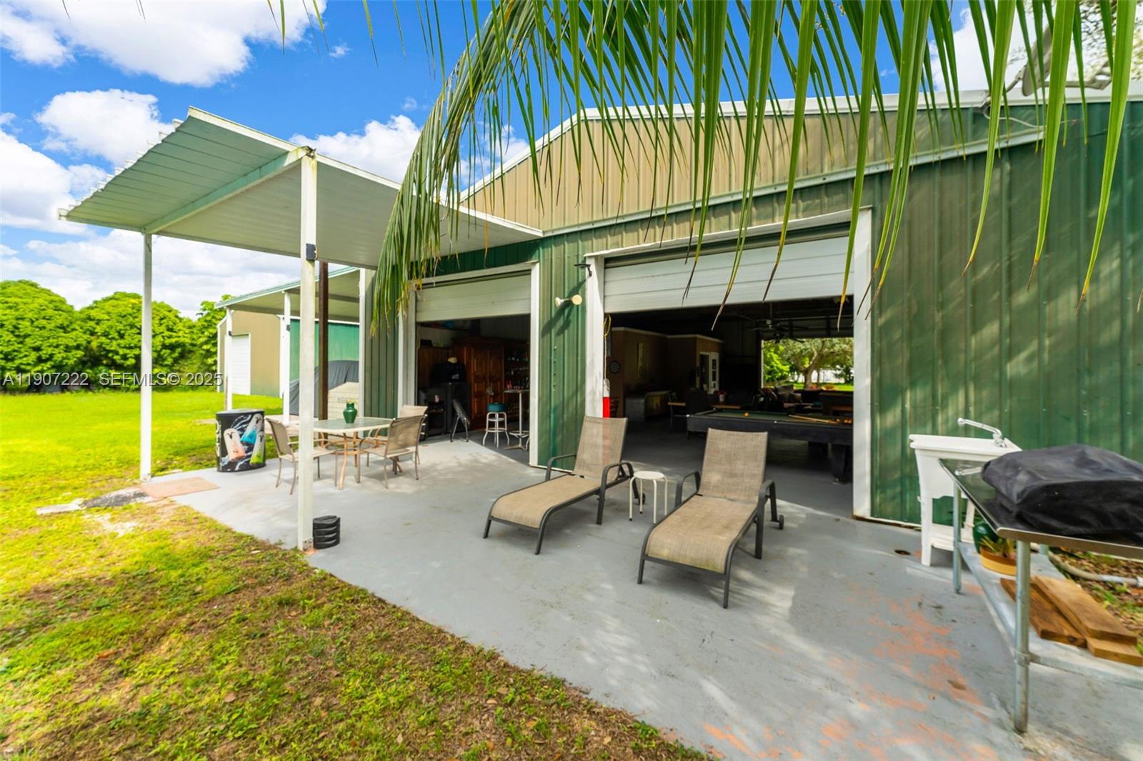 18895 Southwest 212th Street Miami, FL 33187 - Photo 27 of 36 a view of a swimming pool with a patio
