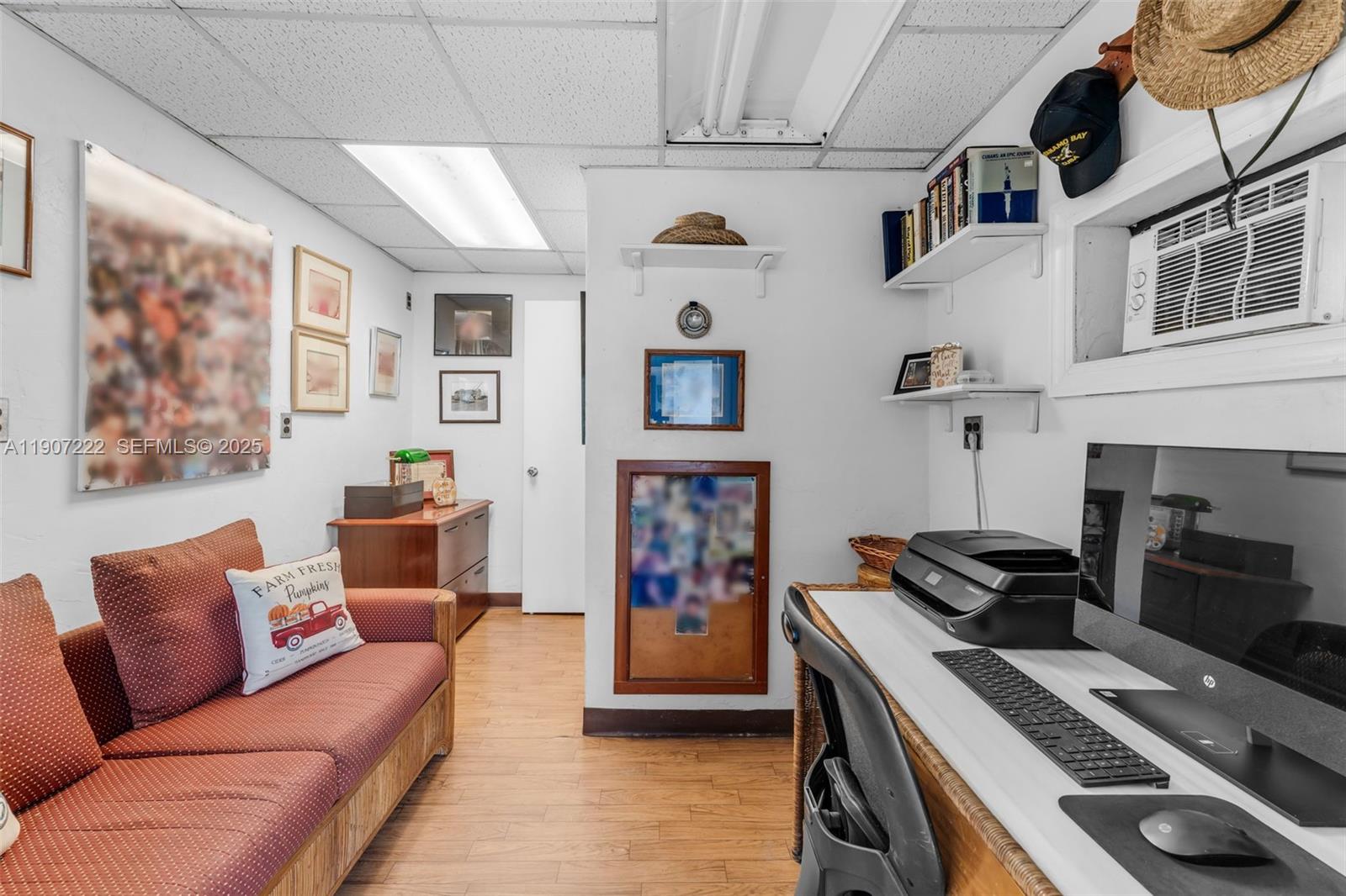 18895 Southwest 212th Street Miami, FL 33187 - Photo 31 of 36 a living room with furniture and a fireplace