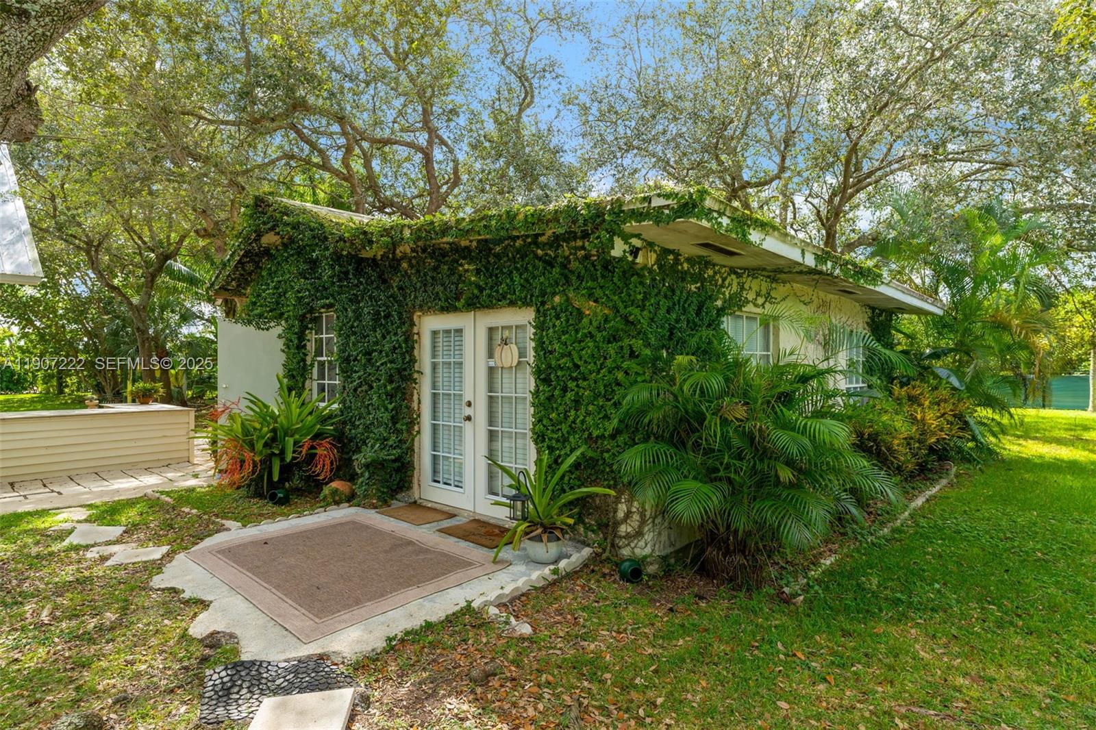 18895 Southwest 212th Street Miami, FL 33187 - Photo 6 of 36 a picture of a yard