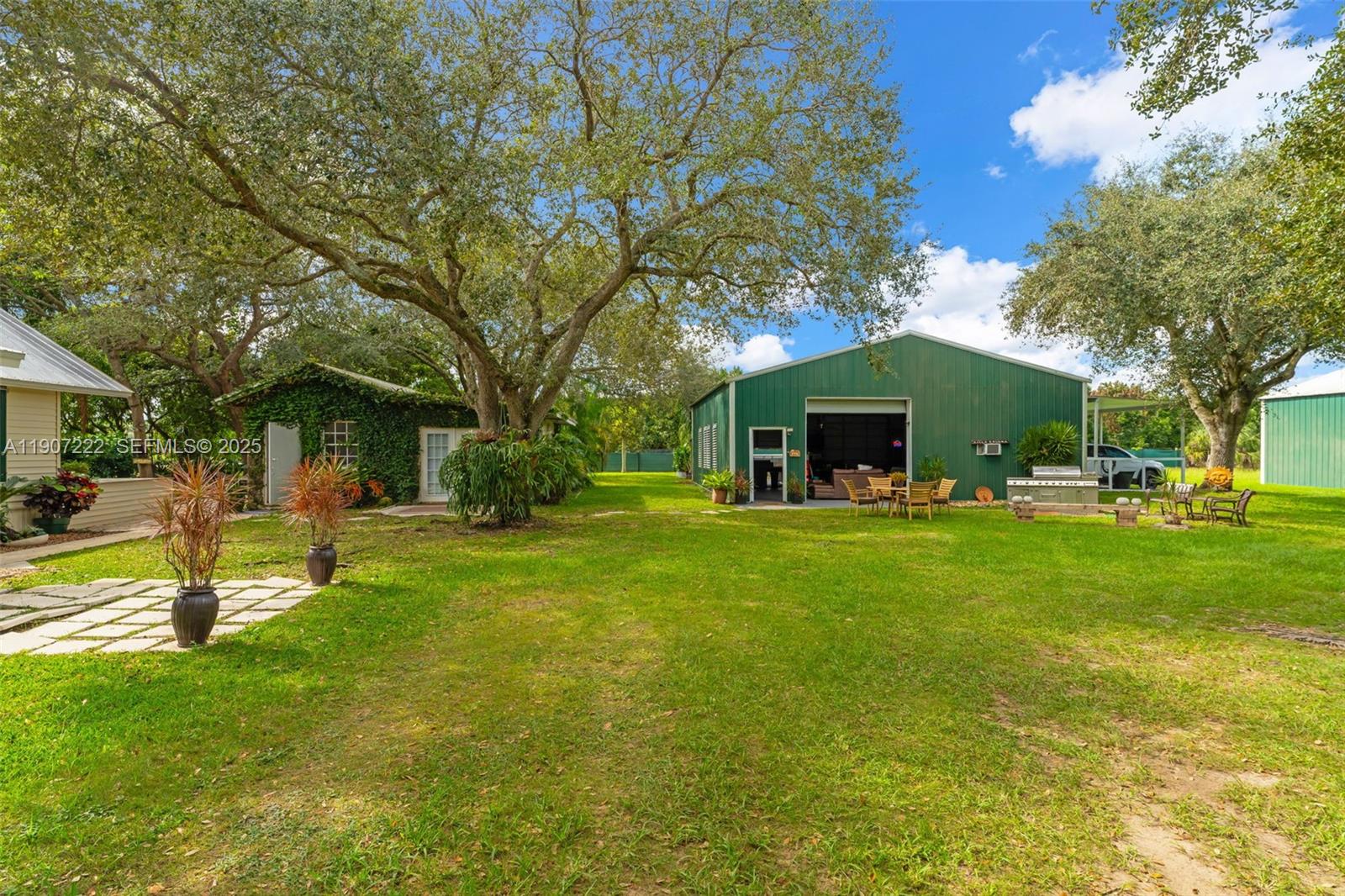 18895 Southwest 212th Street Miami, FL 33187 - Photo 7 of 36 a view of a house with backyard and sitting area
