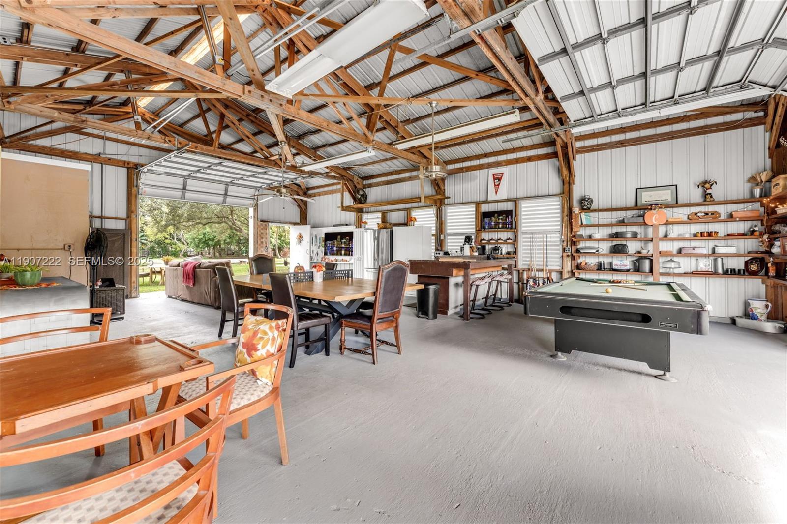 18895 Southwest 212th Street Miami, FL 33187 - Photo 8 of 36 a outdoor space with lots of tables and chairs