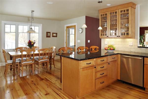1 Valley Spring Road Newton, MA 02458 - Photo 5 of 10 a kitchen with a wooden floor and cabinets