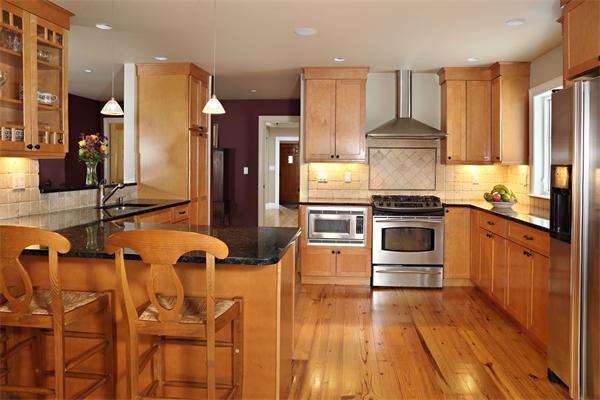 1 Valley Spring Road Newton, MA 02458 - Photo 6 of 10 a kitchen with stainless steel appliances a stove a sink cabinets and wooden floor