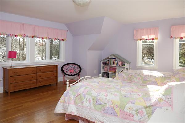 1 Valley Spring Road Newton, MA 02458 - Photo 8 of 10 a bed room with a bed and a large window