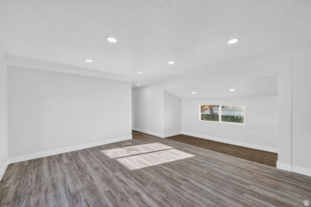2491 Highway 89, Unit 523 Pleasant View, UT 84404 - Photo 6 of 31 Spare room with light wood-style floors and recessed lighting