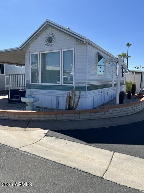 434 South Ironstone Drive, Unit 434 Apache Junction, AZ 85119 - Photo 1 of 19 a front view of a house with a yard