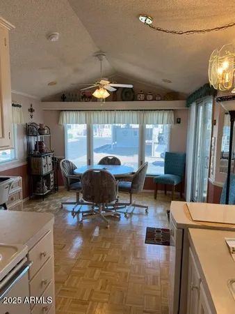 a living room with furniture a window and gym equipment
