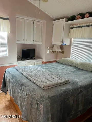 a bedroom with a bed and a fireplace