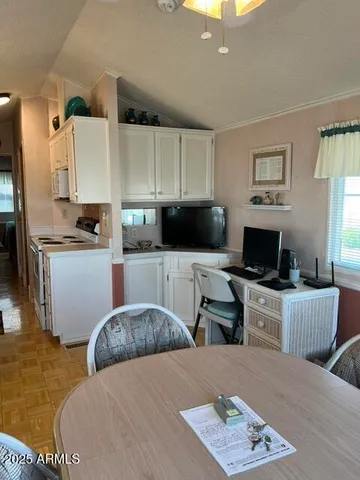 a bedroom with a bed a couch and dresser