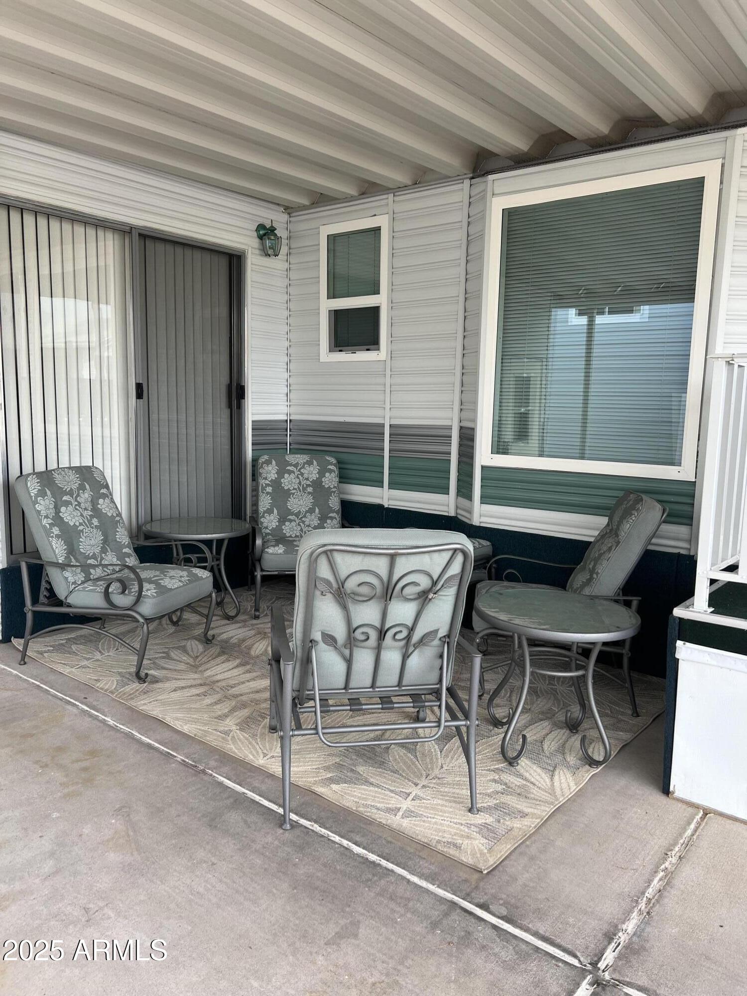 434 South Ironstone Drive, Unit 434 Apache Junction, AZ 85119 - Photo 4 of 19 a view of patio with couple of chairs