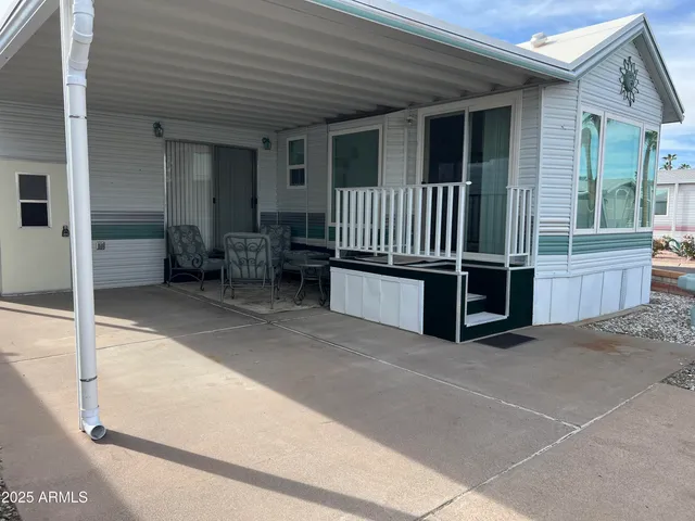 a view of a balcony with furniture