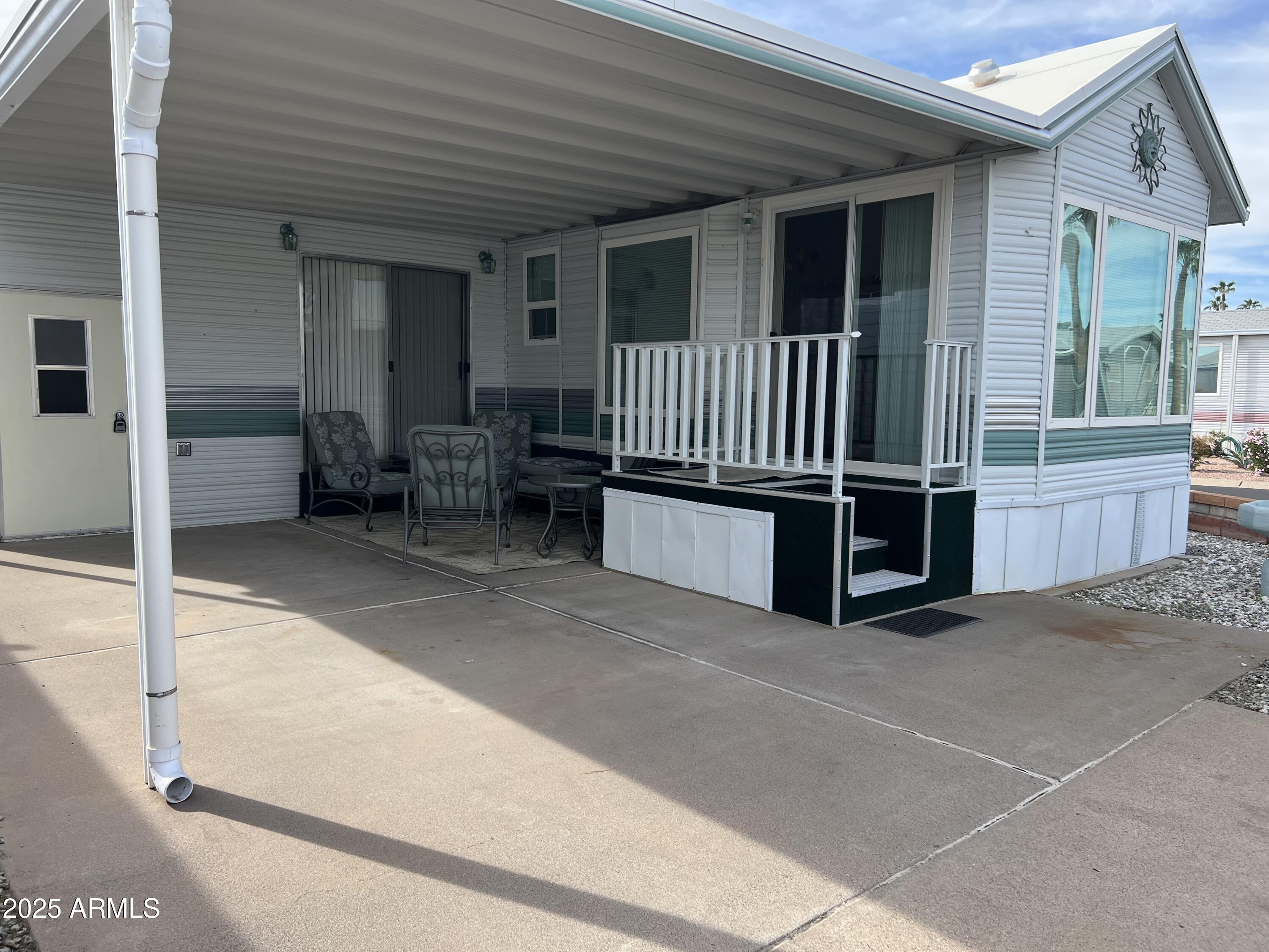 434 South Ironstone Drive, Unit 434 Apache Junction, AZ 85119 - Photo 5 of 19 a view of a balcony with furniture