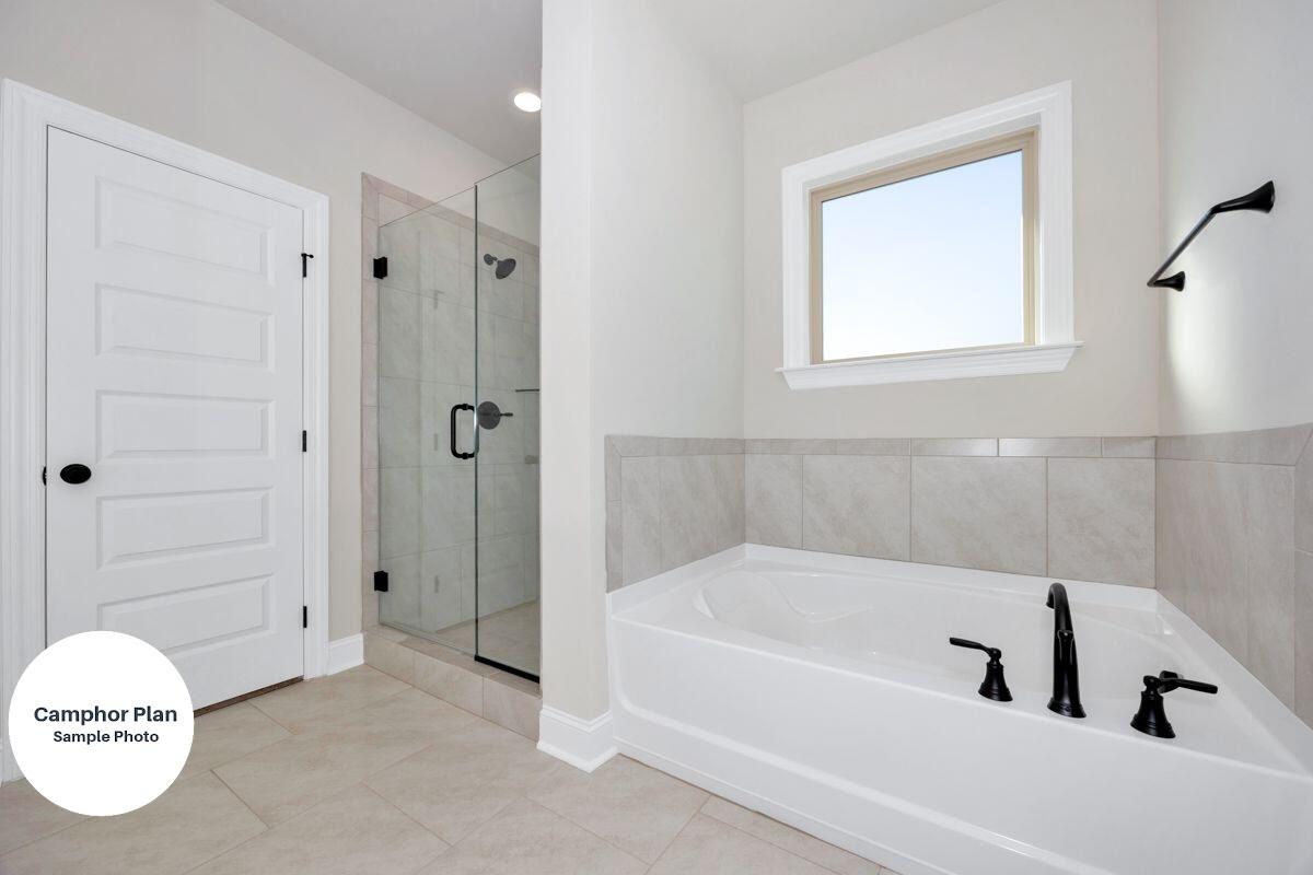 2740 Louis Circle Crestview, FL 32536 - Photo 6 of 8 a bathroom with a tub and a shower