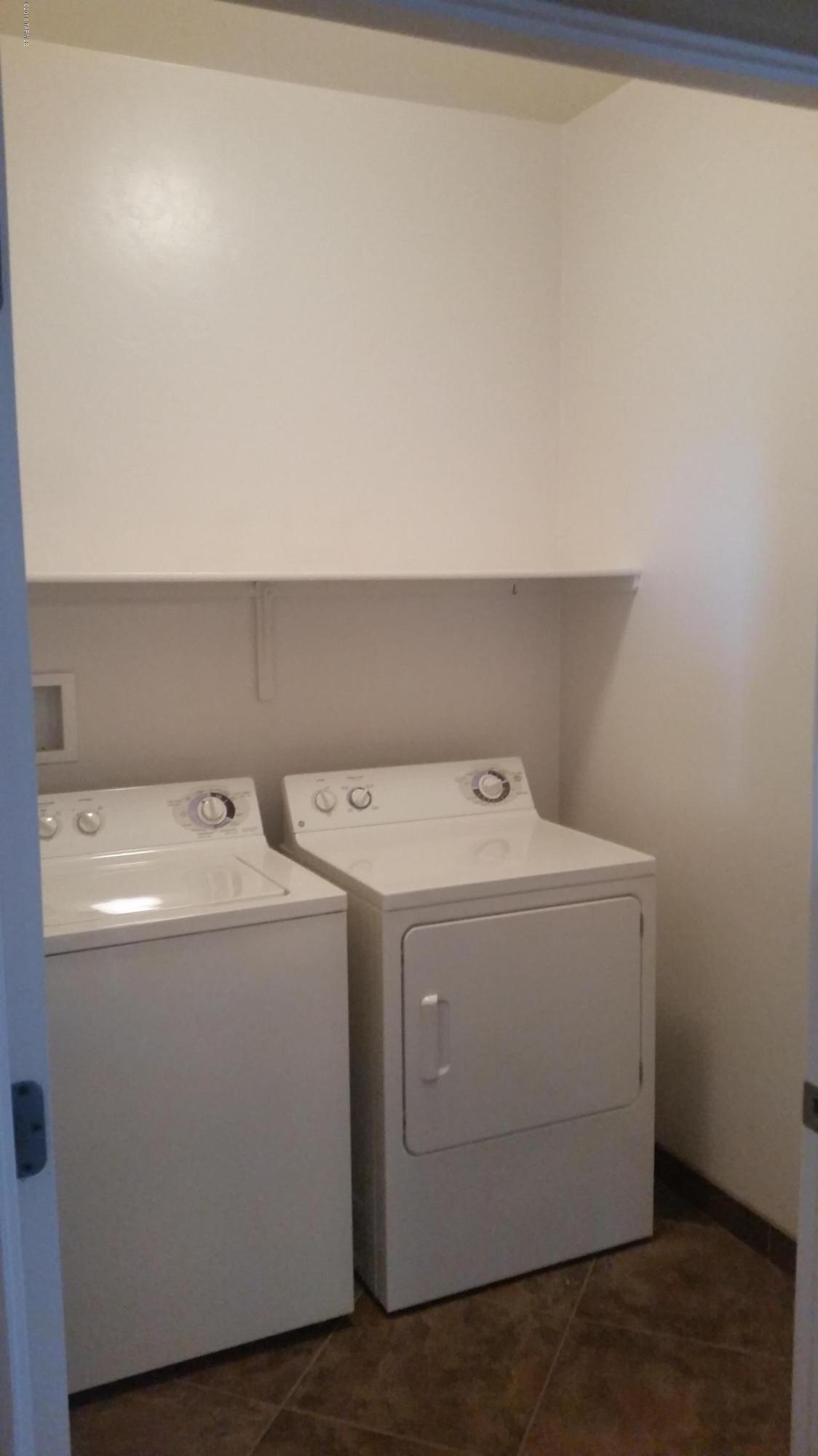 478 East Cedarvale Road Tucson, AZ 85704 - Photo 18 of 39 a utility room with dryer and washer