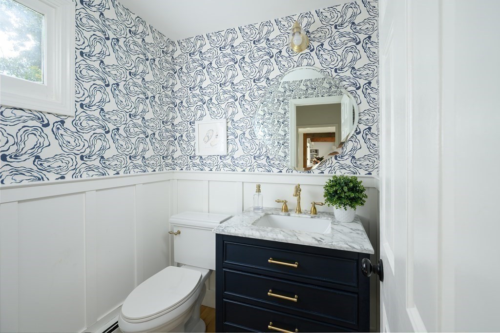 58 Jerusalem Road Cohasset, MA 02025 - Photo 14 of 24 a bathroom with a granite countertop toilet sink and mirror