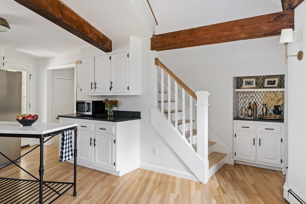 58 Jerusalem Road Cohasset, MA 02025 - Photo 15 of 24 a kitchen with stainless steel appliances a white refrigerator a stove a microwave and cabinets