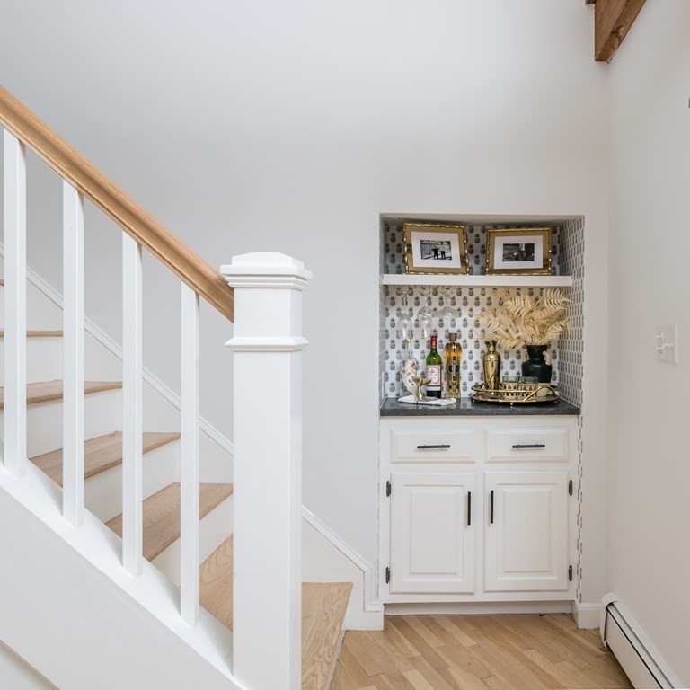 58 Jerusalem Road Cohasset, MA 02025 - Photo 16 of 24 a view of a hallway with wooden floor and cabinet