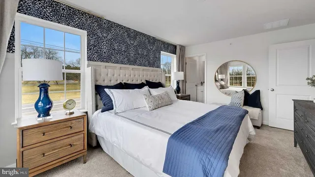 a bed room with a bed and a view of bedroom