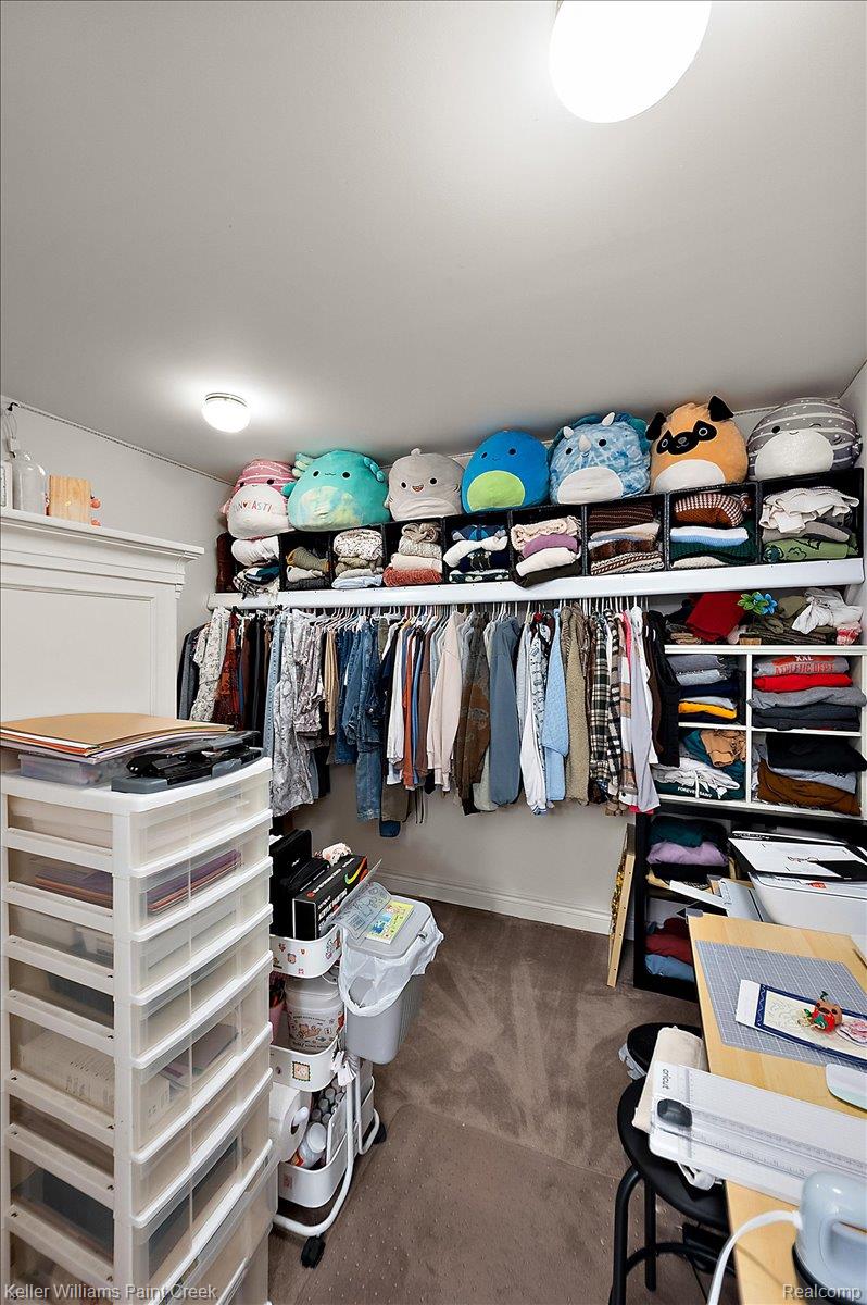 69069 Campground Road Romeo, MI 48065 - Photo 57 of 78 Customizable closet storage system featuring hanging rods and multiple shelving units