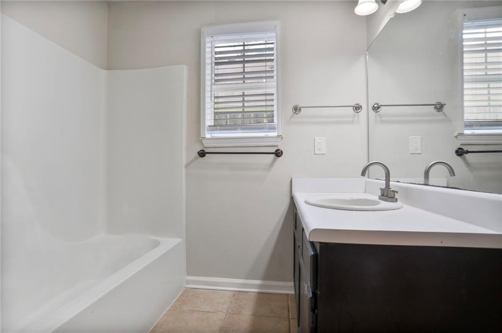 3756 Old Oak Court Powder Springs, GA 30127 - Photo 11 of 14 a bathroom with a sink and a bathtub