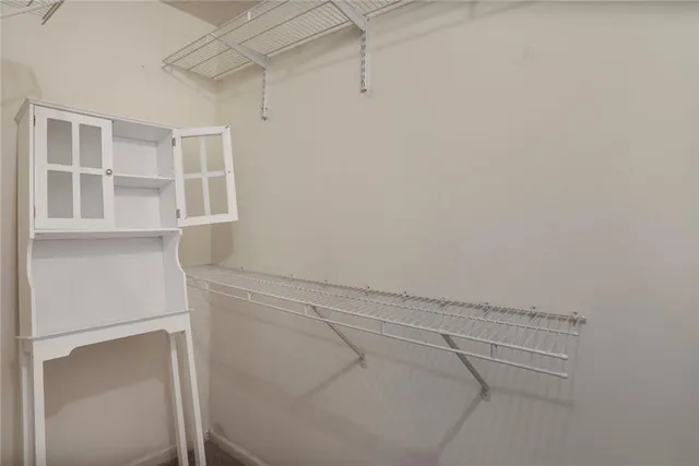 a view of storage and utility room with empty racks