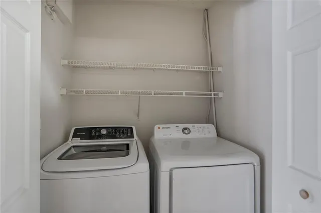 a utility room with dryer and washer
