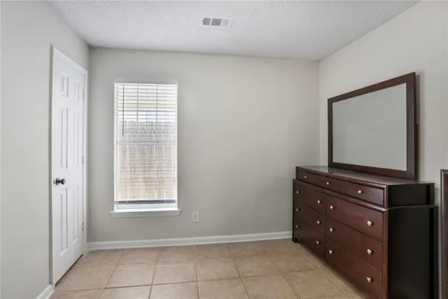 a room with a dresser and a mirror