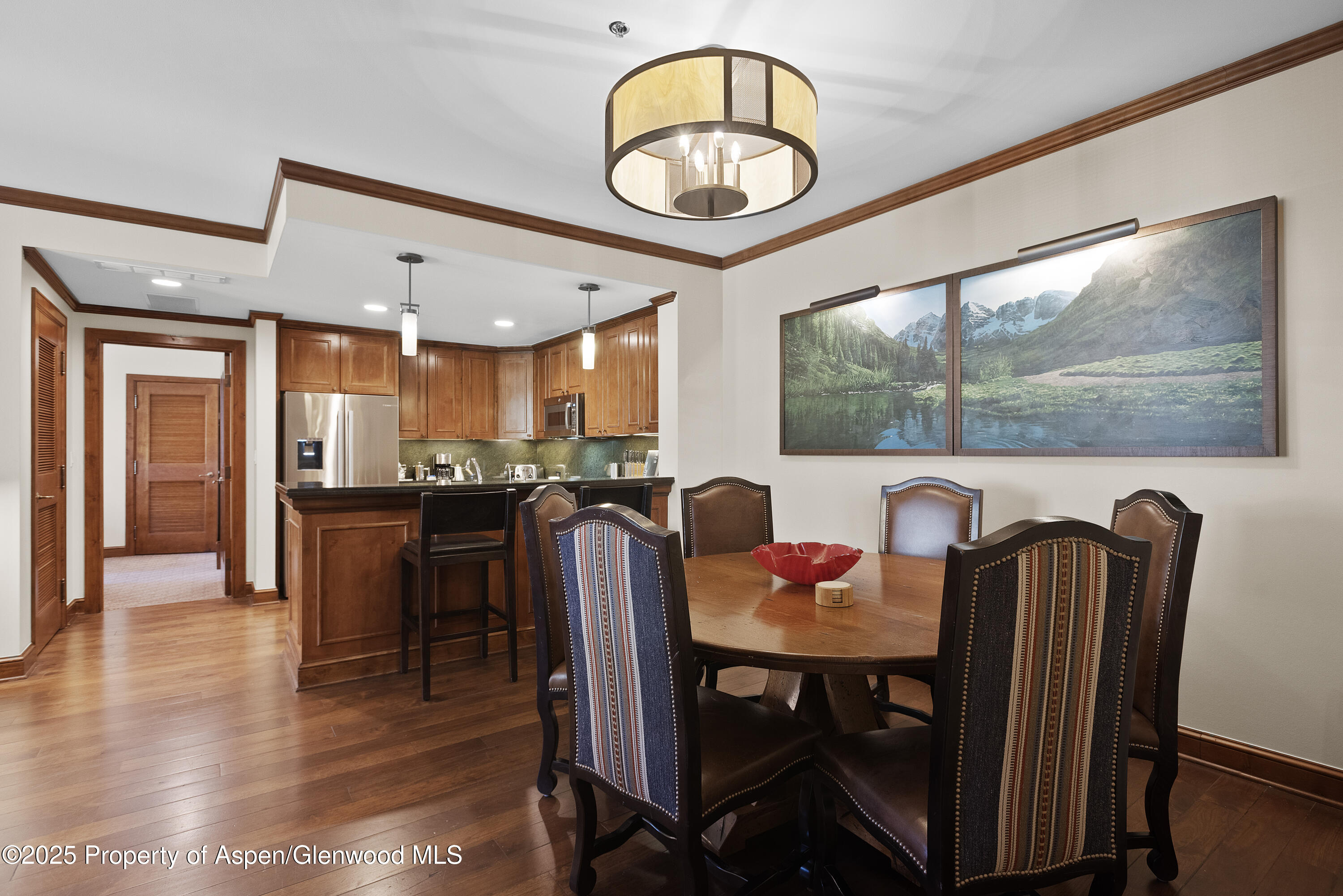 39 Boomerang Road, Unit 8402/WINTER INTEREST 16 Aspen, CO 81611 - Photo 2 of 12 a view of a dining room with furniture window and wooden floor