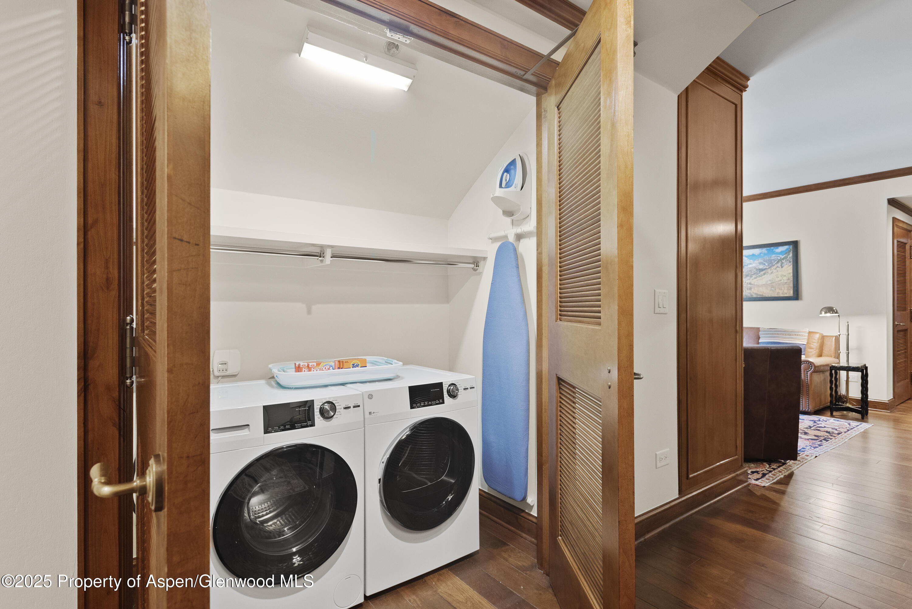 39 Boomerang Road, Unit 8402/WINTER INTEREST 16 Aspen, CO 81611 - Photo 6 of 12 a view of a hallway with washer and dryer