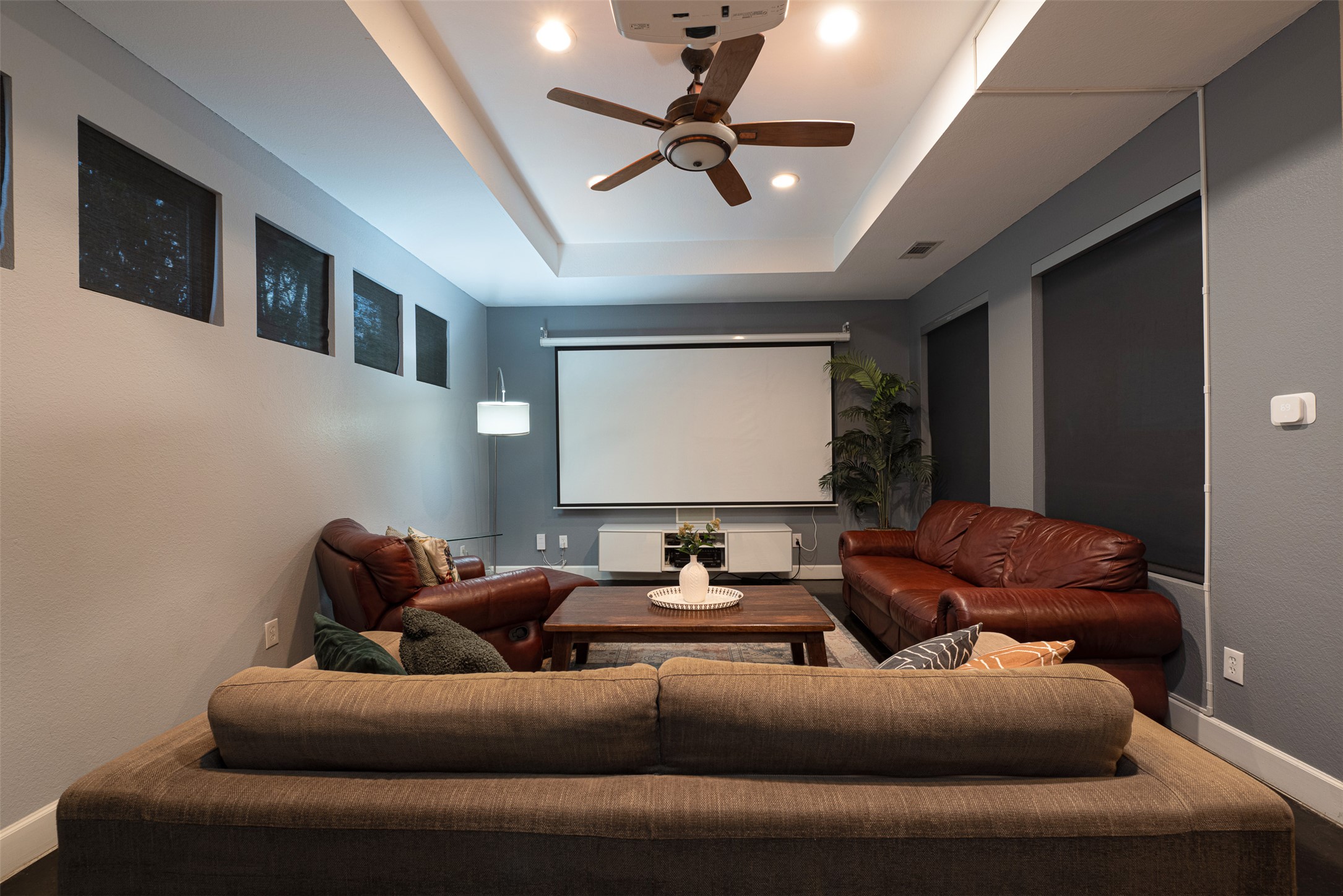 2302 East 9th Street Austin, TX 78702 - Photo 5 of 31 An inviting media room for movie nights and entertaining with a ceiling fan for comfort.