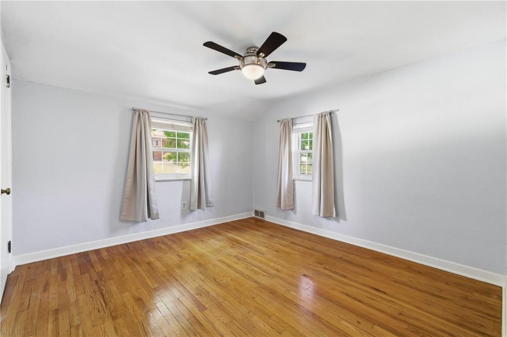 4883 East Willock Road Pittsburgh, PA 15227 - Photo 20 of 33 a view of an empty room with wooden floor and a window