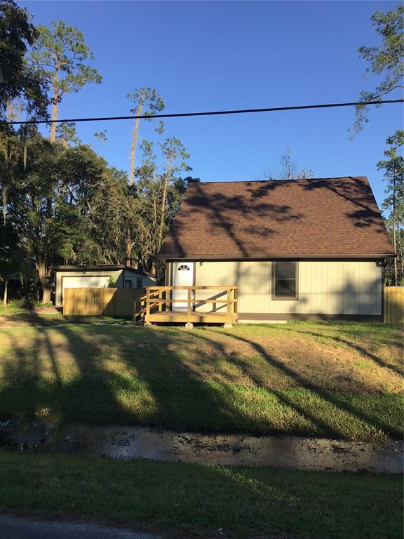 a view of a street with a building in the background