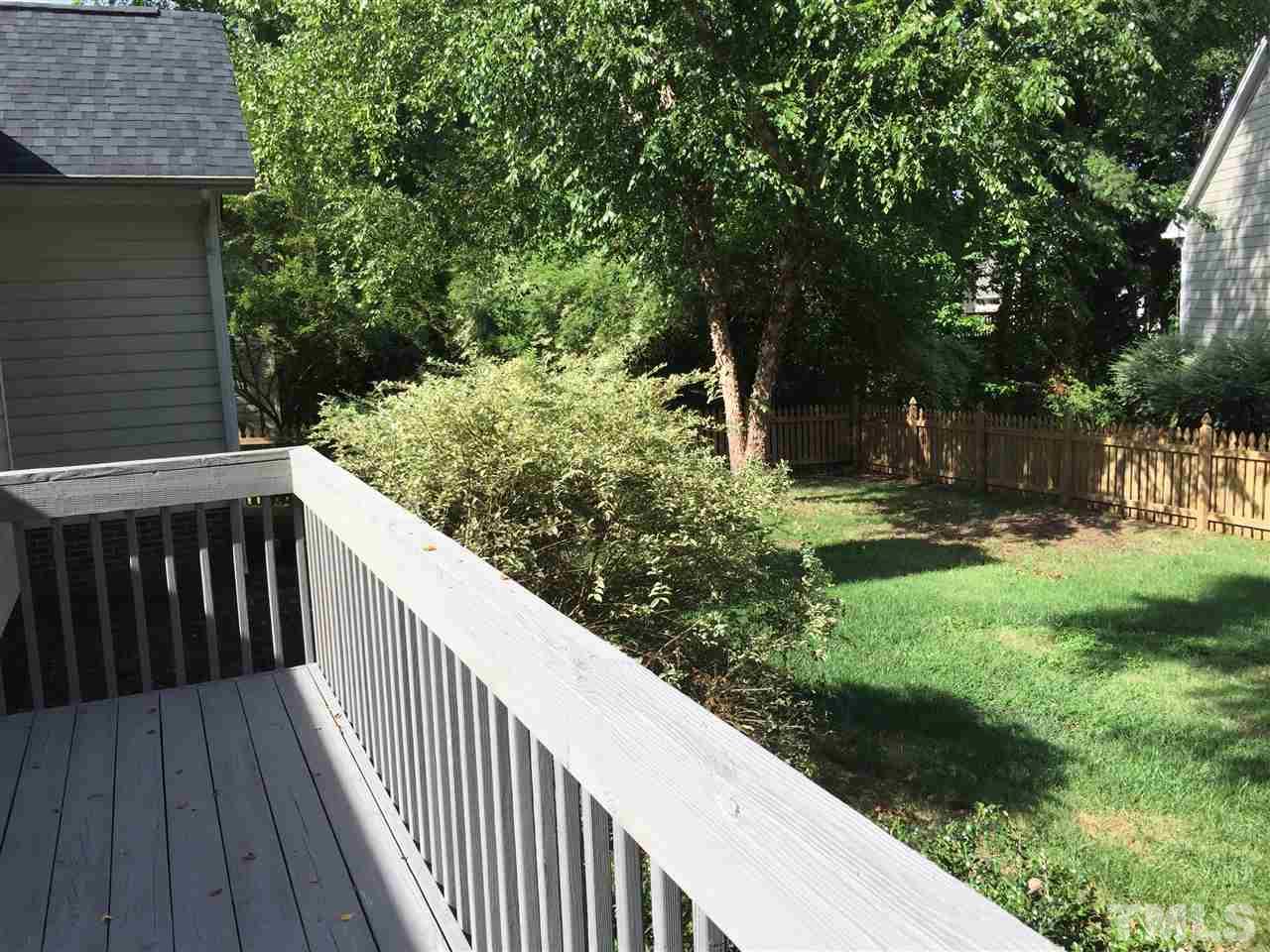 12109 Amoretto Way Raleigh, NC 27613 - Photo 7 of 8 a balcony with trees in front of it