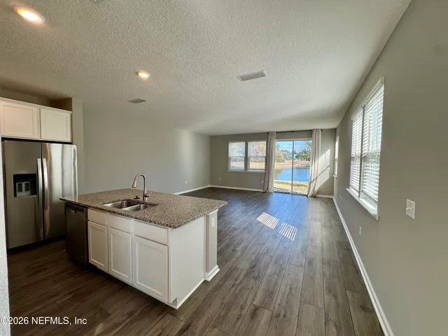 a view of lake with green space