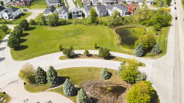 a view of a swimming pool with a yard