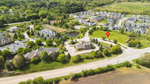 an aerial view of residential houses with outdoor space