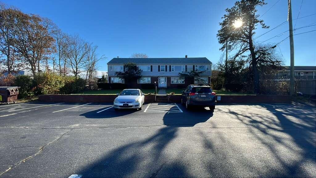 451 Main Street, Unit 2 Dennis Port, MA 02639 - Photo 1 of 8 a view of a two chairs in the patio