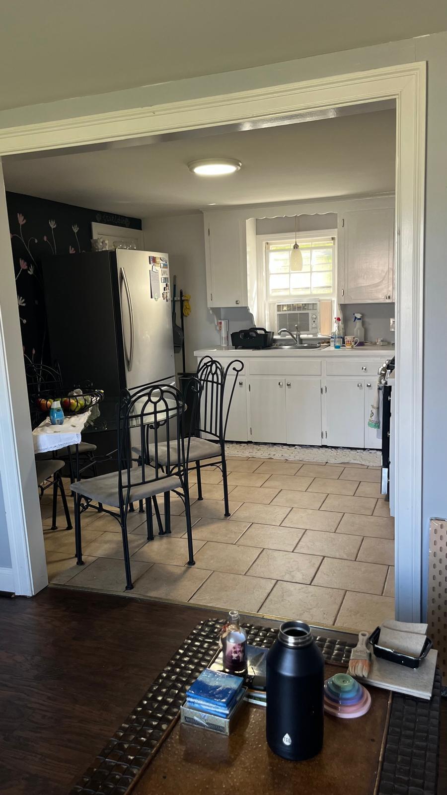 451 Main Street, Unit 2 Dennis Port, MA 02639 - Photo 2 of 8 a kitchen with furniture and a potted plant