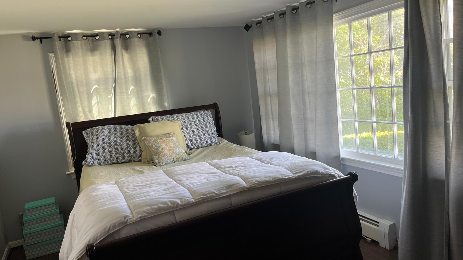 451 Main Street, Unit 2 Dennis Port, MA 02639 - Photo 3 of 8 a bedroom with a bed and a window