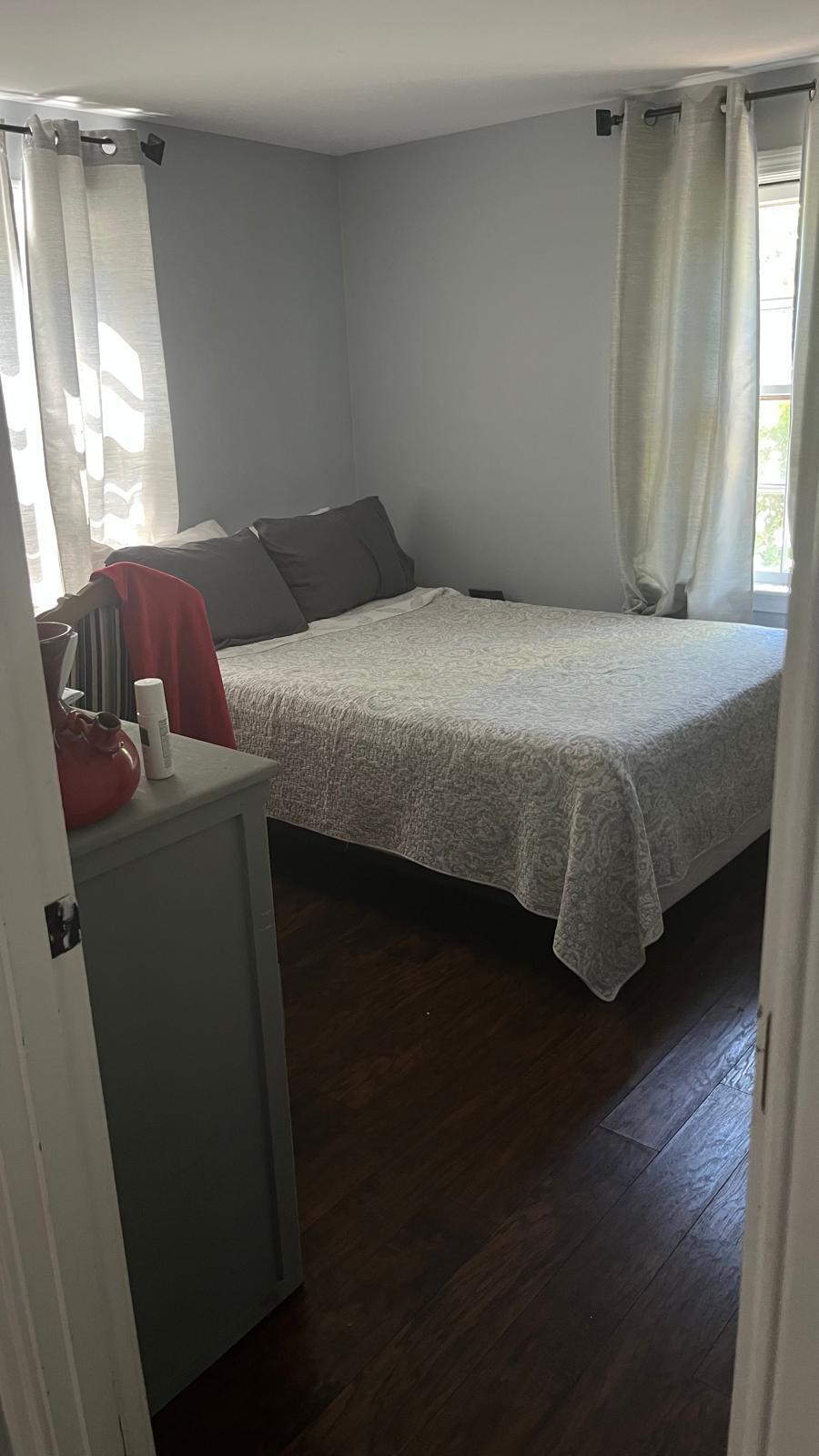 451 Main Street, Unit 2 Dennis Port, MA 02639 - Photo 4 of 8 a bedroom with a bed and a window