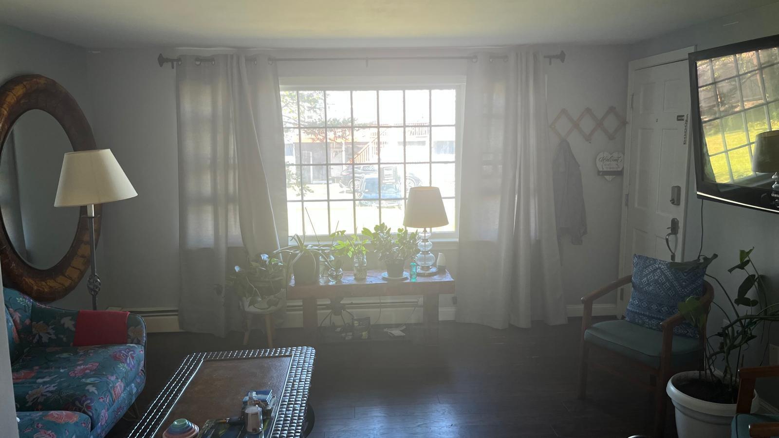 451 Main Street, Unit 2 Dennis Port, MA 02639 - Photo 7 of 8 a living room with furniture and a flat screen tv